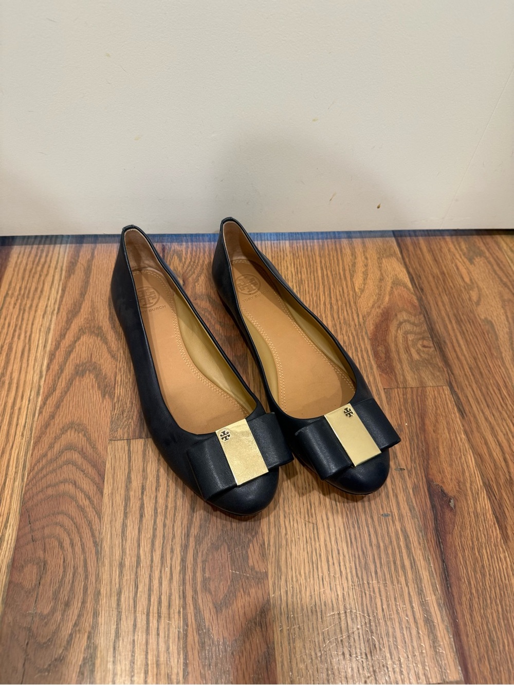 Tory Burch Black Leather Flats with Gold Bow Detail